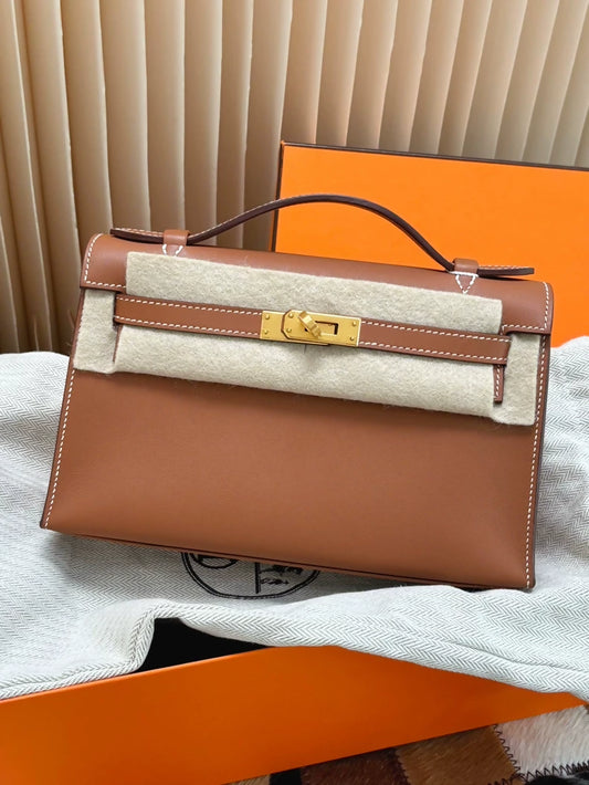 Hermès Kelly pochette Gold swift leather with gold hardware
