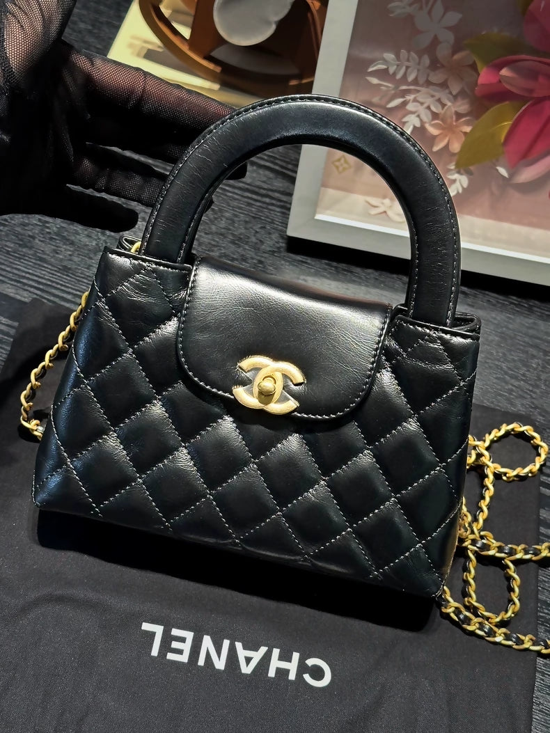 Chanel 23k small Kelly black quilted handbag gold hardware