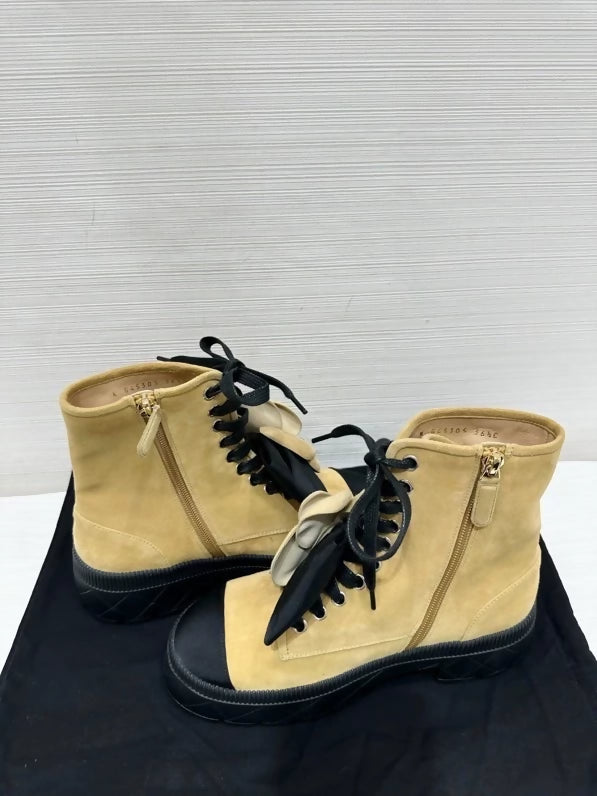 Chanel's popular black and suede camellia ankle boots with bow, size 36.5,