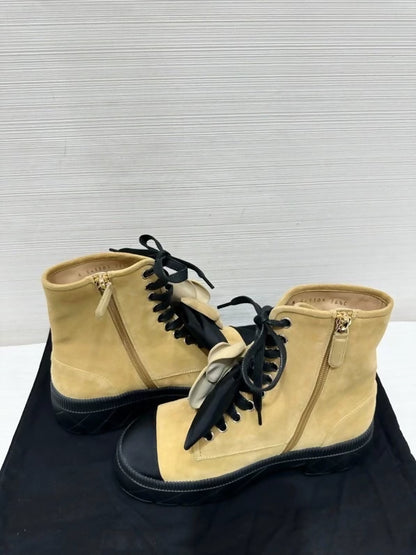 Chanel's popular black and suede camellia ankle boots with bow, size 36.5,