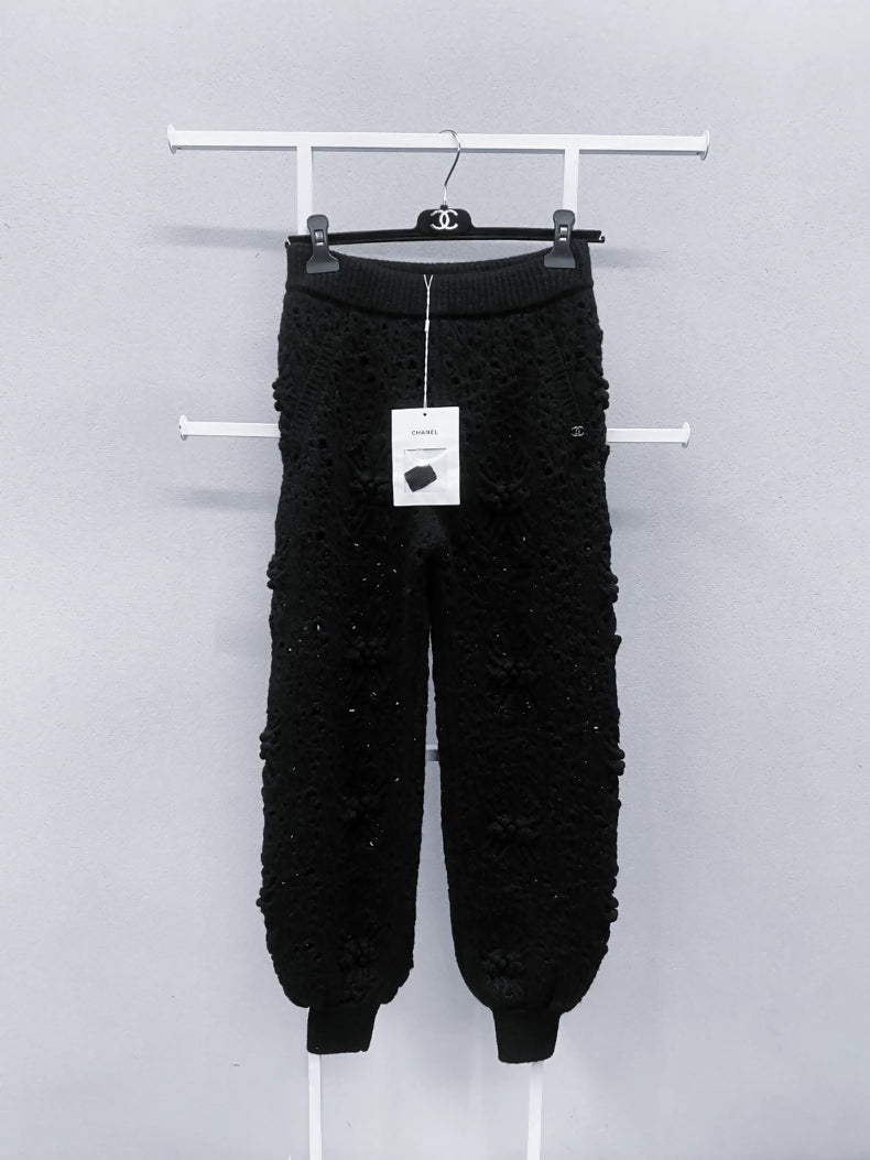 Chanel black camellia knit trousers