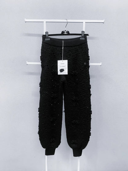 Chanel black camellia knit trousers